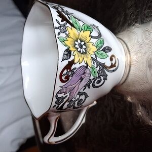 Charming Ceramic Teacup with Yellow and Green Floral Design